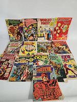 Group shot of approximately 15 vintage Marvel comic books arranged in three rows