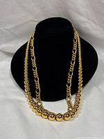 Both necklaces displayed on bust