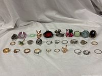 Full view of all 30 rings arranged in rows showing variety