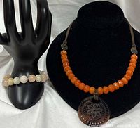 Necklace and bracelet displayed together