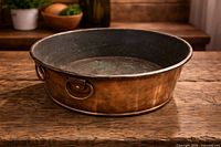 Top angled view of copper basin showing interior patina and exterior finish