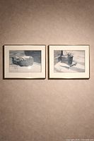 Both framed Jack Reid prints displayed side by side on wall