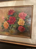 Full view of framed floral oil painting showing artwork, frame, and liner