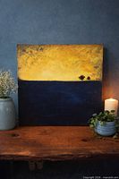 Full view of painting staged on table showing overall composition