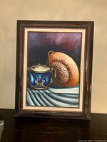 Full view of framed still life painting