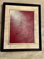 Full view of framed abstract cityscape painting showing colors, texture and frame