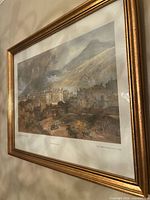 Oblique view of framed Palace of Holyroodhouse print showing gilt frame, mat and artwork