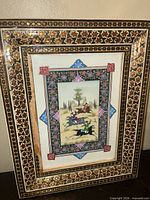 Front view showing entire framed artwork and inlaid pattern