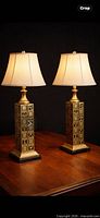 Both brass lamps lit on wood surface with shades (shades not included)