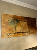 Front view of signed abstract painting on wall