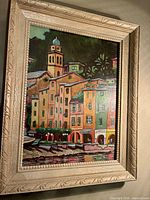 Front view showing entire framed oil painting with harbor scene