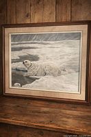 Front view of framed monochromatic polar bear artwork showing signature and frame