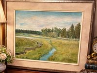 Full view of framed pastoral landscape painting showing scene, mat, frame