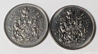 Obverse and reverse views of both 50-cent coins