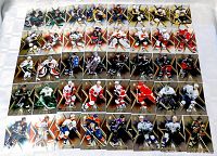 Overhead view of approximately 40 Upper Deck SPx hockey cards laid out in five rows on table