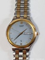 Front view of Citizen quartz watch face and bezel