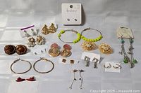 Full assortment of 15 earring pairs laid out
