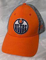 Front view showing Edmonton Oilers logo and orange visor