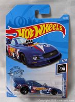 Front of sealed Hot Wheels card showing blue drag car