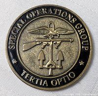 Obverse showing Special Operations Group emblem, rifle, winged device, crossed spears, motto "Tertia Optio"