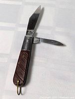 Pocket knife open showing two blades