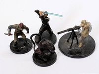 Four Star Wars mini figures on bases