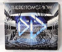 Front cover of CD showing album art and autographs