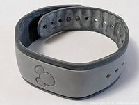Top view of grey Disney MagicBand showing Mickey icon