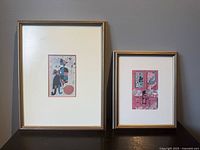 Both framed prints side by side showing relative sizes and framing