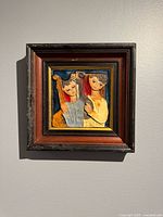 Full view of framed ceramic tile artwork