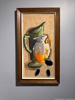 Front view of framed still-life painting