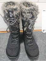 front view of pair of black Columbia Omni-Heat boots showing laces and faux fur collar