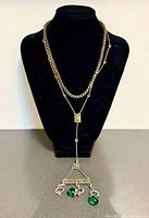 Both necklaces displayed on bust showing length and layering