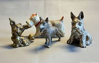 All four dog figurines grouped