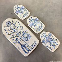 Front view showing all four plaques with designs visible