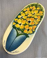 Front view showing floral design and overall condition