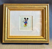 Front view of gold framed Mickey Mouse etching