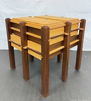 Three-quarter view closed showing maple panels and walnut legs