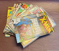 Stack of all twelve bagged comics fanned out