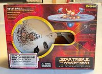 Front of retail box showing starship through window and product graphics