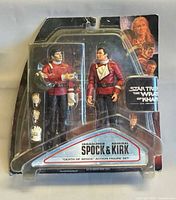 Front view of unopened action figure set showing both figures and accessories