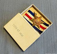Medal in original box with ribbon visible