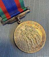 Obverse of medal with ribbon attached