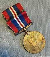 Full view of medal with ribbon attached