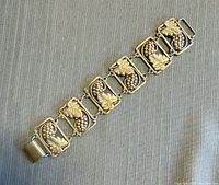 Full view of sterling grape panel bracelet laid flat