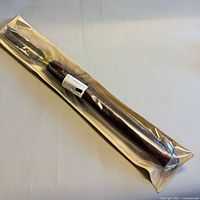 Full view of gouge in clear sleeve