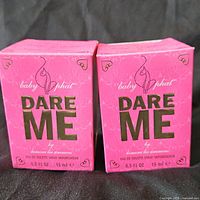 Front view of two Baby Phat Dare Me perfume boxes