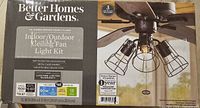 Retail box showing Better Homes & Gardens indoor/outdoor ceiling fan light kit, oil-rubbed bronze finish, 3 lights