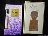 Front view of both boxed perfumes