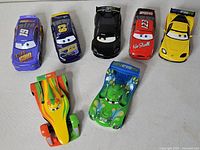 Seven Disney Pixar Cars diecast racers displayed together